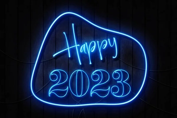 Happy 2023 Neon Sign Dark Wooden Wall — стоковое фото