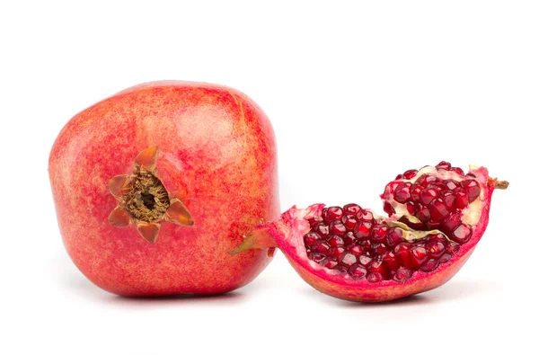 Pomegranate and a slice on white — Stock Photo, Image