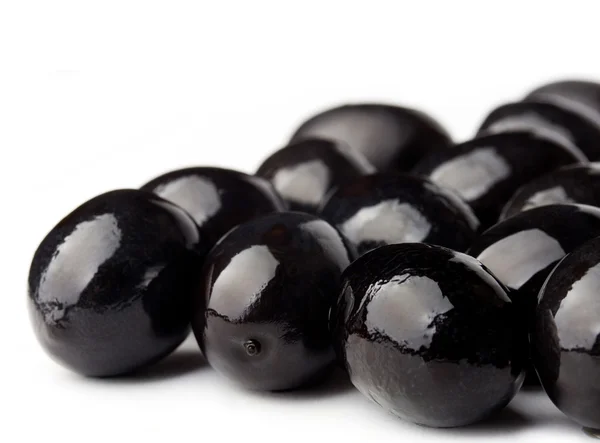 Black olives closeup shot on white background — Stock Photo, Image