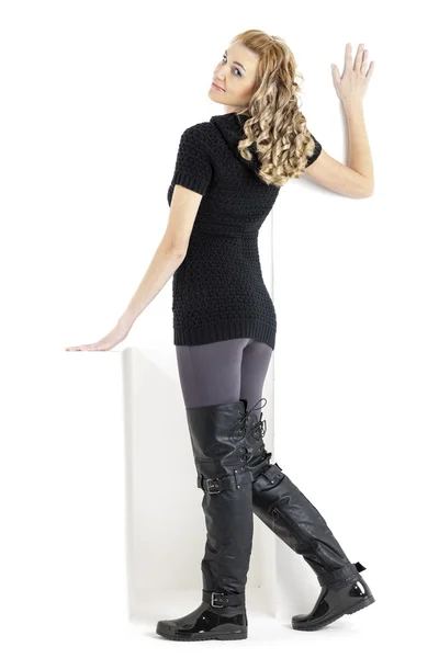 Standing woman wearing black clothes and black boots — Stock Photo, Image