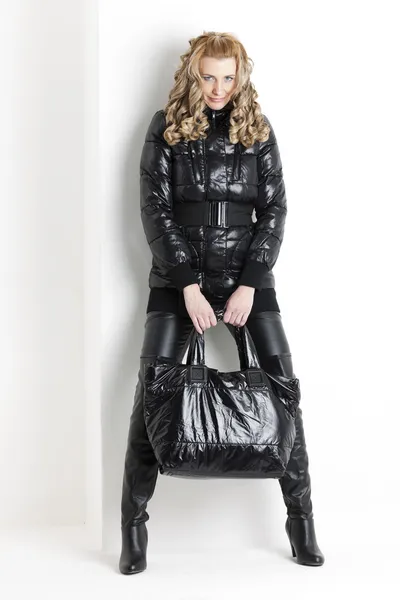 Standing woman wearing black clothes and black boots — Stock Photo, Image