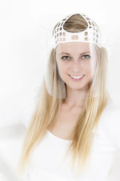 Portrait of young woman with a wearing face protective shield — Stock Photo, Image