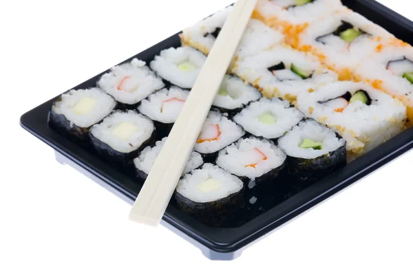 Sushi mit Essstäbchen isoliert über weißem Hintergrund — Stockfoto