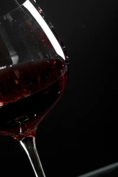 Decanter with red wine and glass on a old stone background — Stock Photo, Image