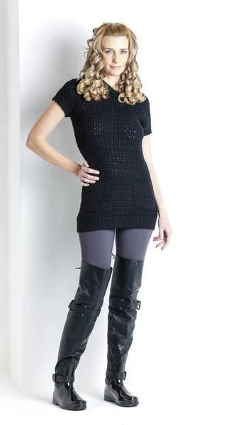 Standing woman wearing black clothes and black boots — Stock Photo, Image