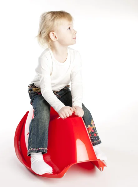 Little girl sitting on swing — Stock Photo, Image