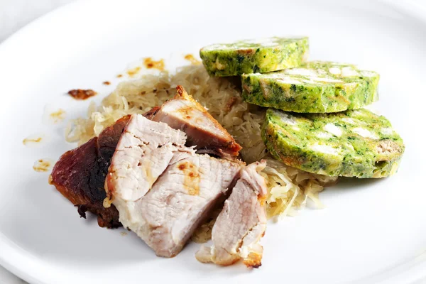 Pork meat with herbal dumplings and cabbage — Stockfoto