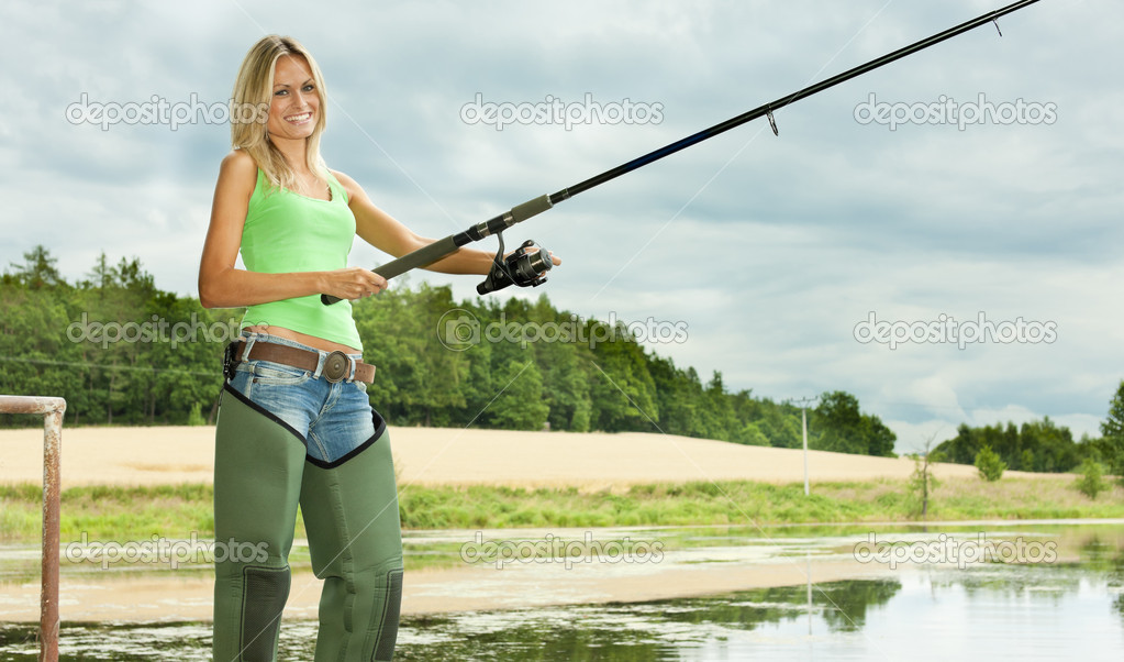 Woman fishing at pond — Stock Photo © phb.cz #18516695