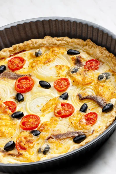 Cake with anchovies, cherry tomatoes and black olives — Stock Photo, Image