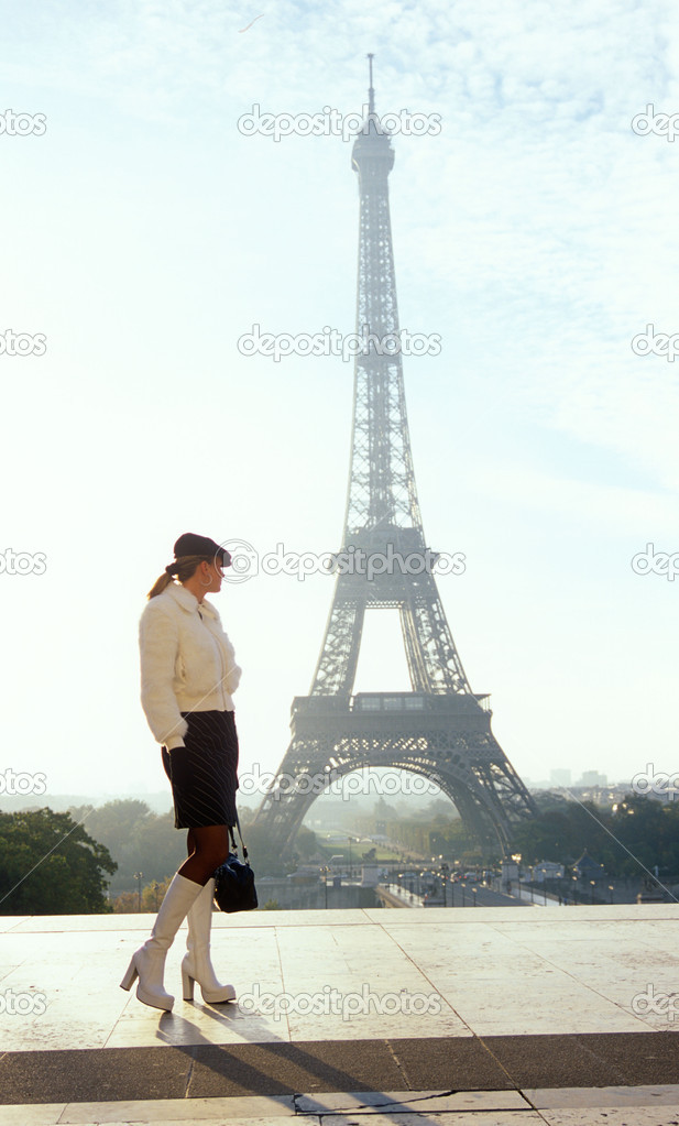 woman and Eiffel Tower, Paris, France