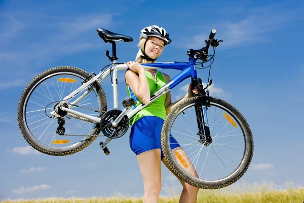 Biker with bottle of water — Stock Photo, Image