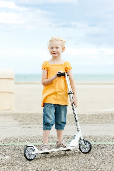 Little girl with a scooter — Stock Photo, Image