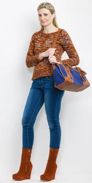 Standing woman wearing fashionable platform brown shoes with a h — Stock Photo, Image