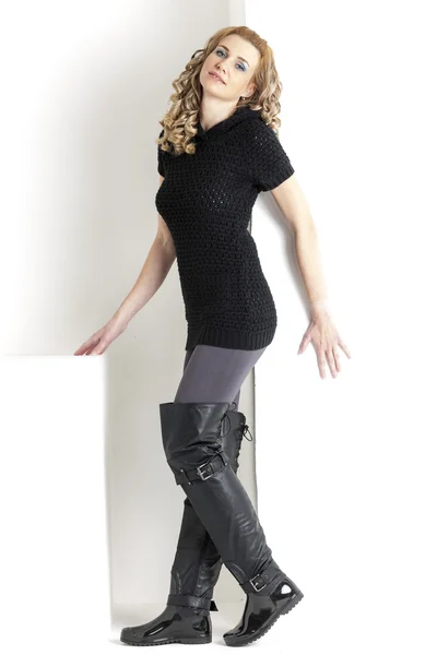 Standing woman wearing black clothes and black boots — Stock Photo, Image