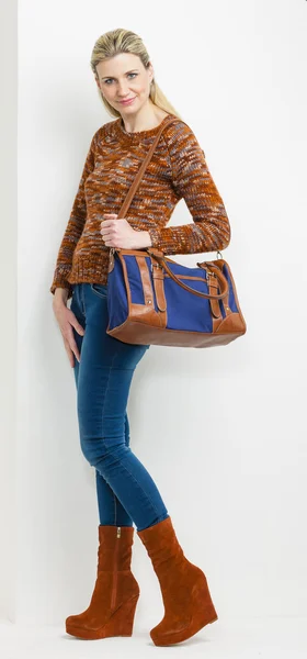 Standing woman wearing fashionable platform brown shoes with a h — Stock Photo, Image