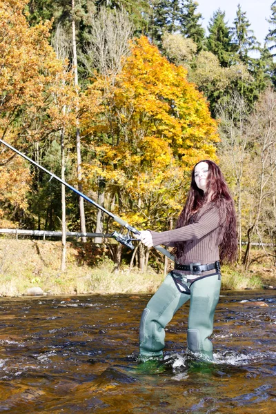 Woman fishing in Otava river, Czech Republic Stock Image
