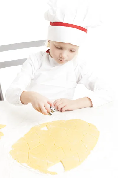 Little girl cutting cookies — Stock Photo, Image