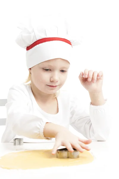 Little girl cutting cookies — Stock Photo, Image