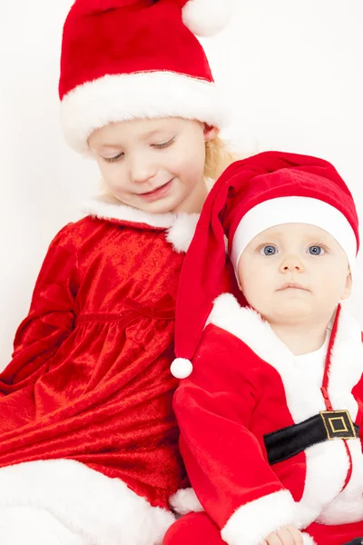 Две рождественские девочки — стоковое фото