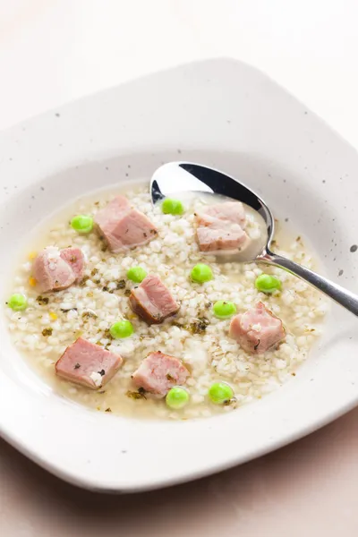 Smoked meat bouillon with pearl barley and peas — Stock Image Smoked meat bouillon with pearl barley and peas Stock Photo