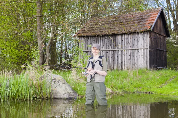 Woman fishing — Stock Photo, Image