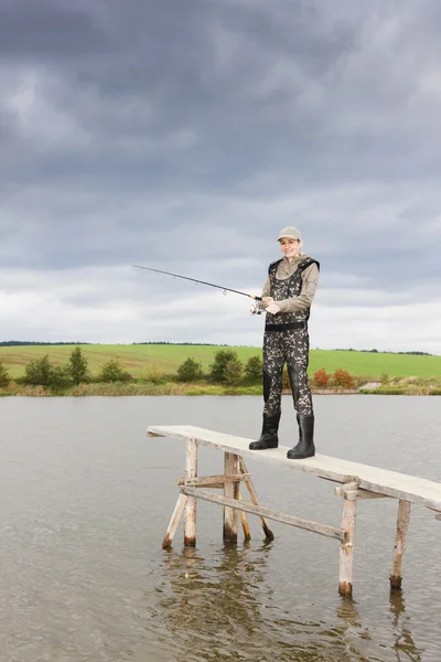 Woman fishing — Stock Photo, Image