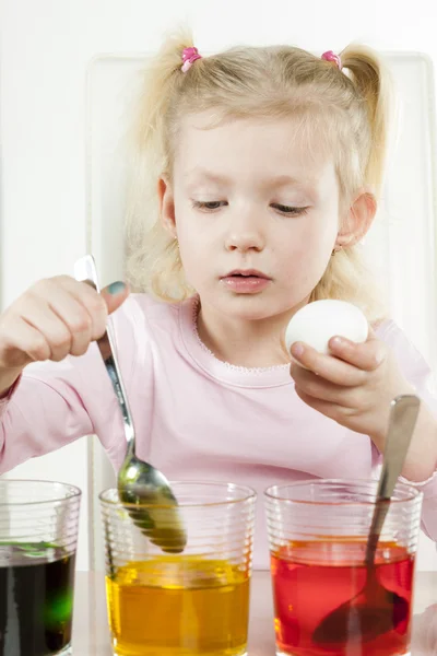 Girl coloring Easter eggs — Stock Photo, Image