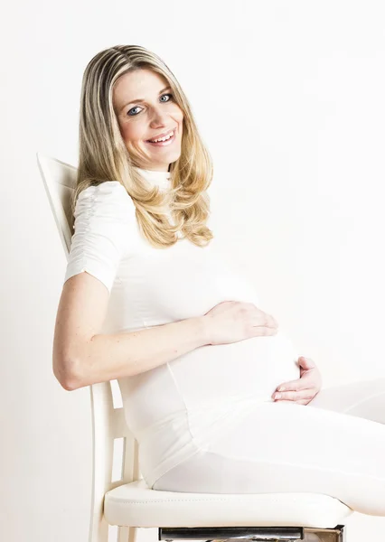 Sitting pregnant woman — Stock Photo, Image