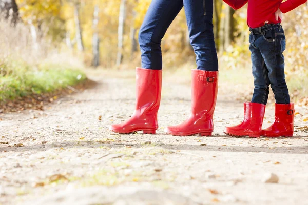 Mother and daughter in rubber boots — Stock Photo, Image