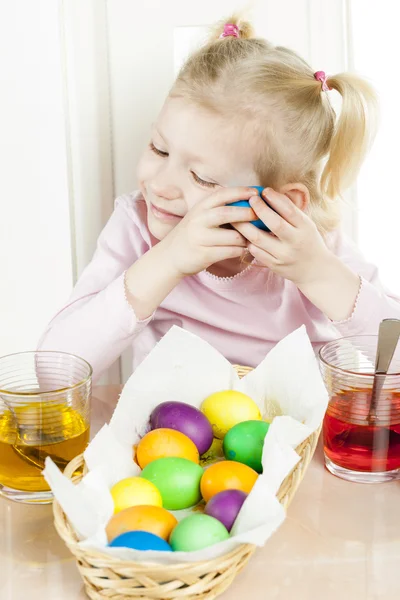 Little girl during Easter eggs' coloration — Stock Photo, Image