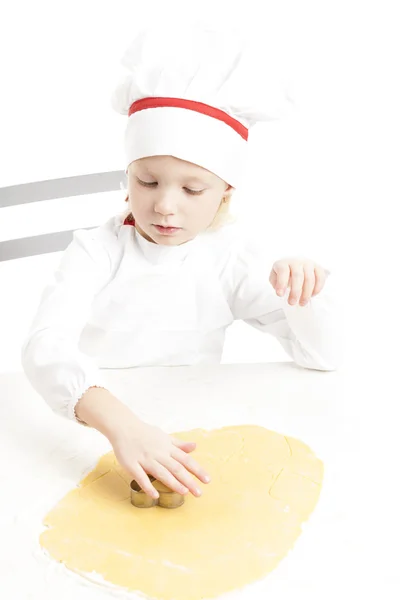 Meisje snijden cookies — Stockfoto