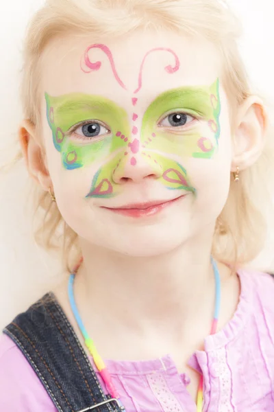 Chica con pintura facial — Foto de Stock