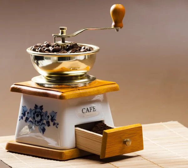 Coffee mill with coffee beans — Stock Photo, Image