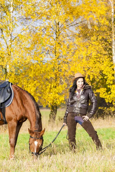 Equestrian with her horse — Stock Photo, Image