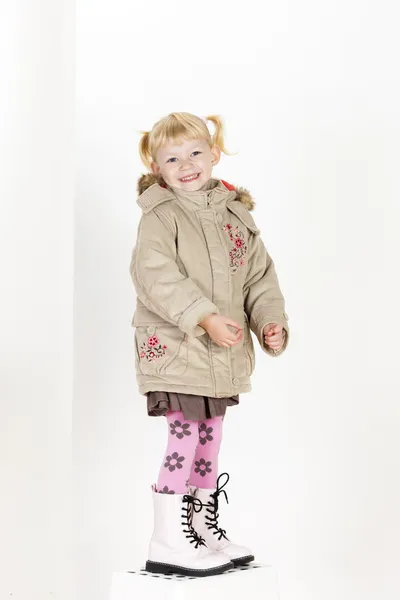 Little girl wearing a coat — Stock Photo, Image