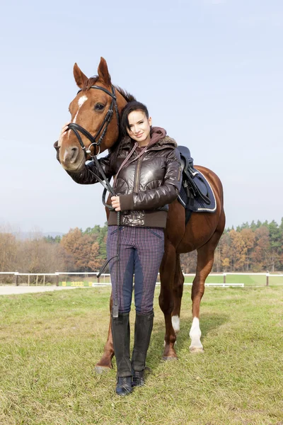 Equestrian with her horse — Stock Photo, Image