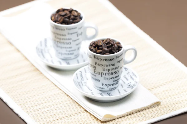 Cups full of coffee beans — Stock Photo, Image