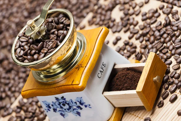 Coffee mill with beans — Stock Photo, Image