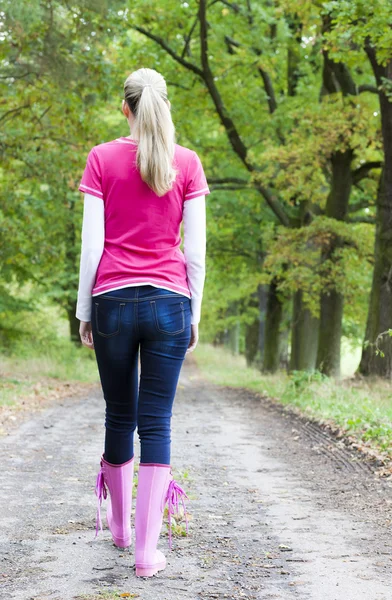 Woman wearing rubber boots — Stock Photo, Image