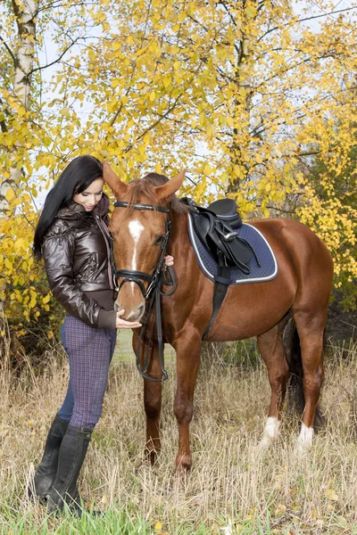 Equestrian with her horse — Stock Photo, Image