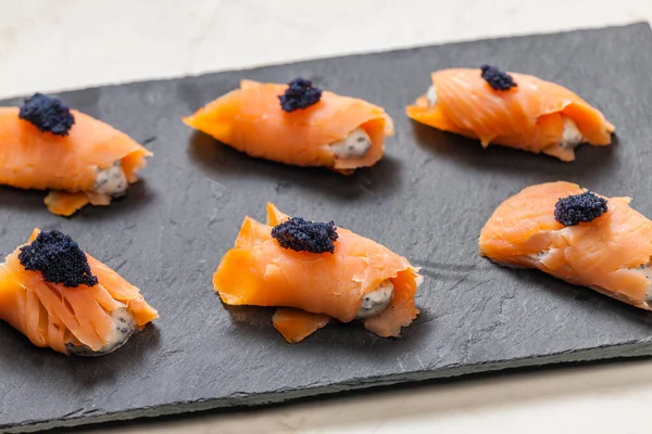 Smoked Salmon Rolls Filled Cream Cheese Black Caviar — Stock Photo, Image