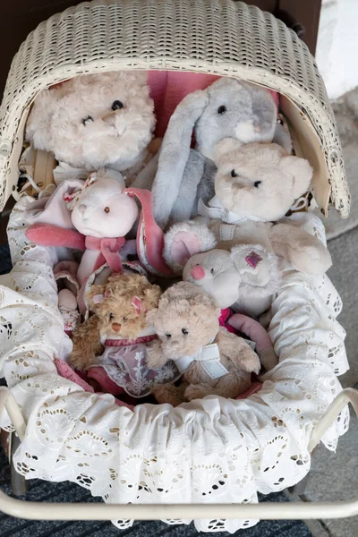 stuffed toys in the old fashioned buggy