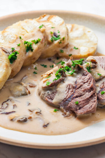 meat with mushroom sauce and karlsbad dumplings