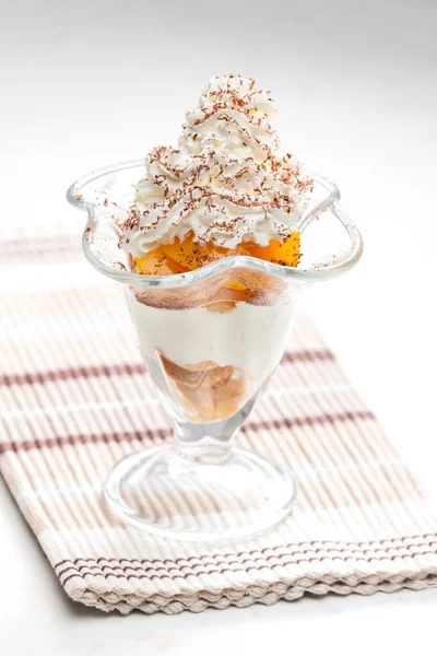 ice cream with stewed peach and whipped cream