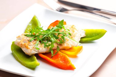 Still life cod with grilled peppers