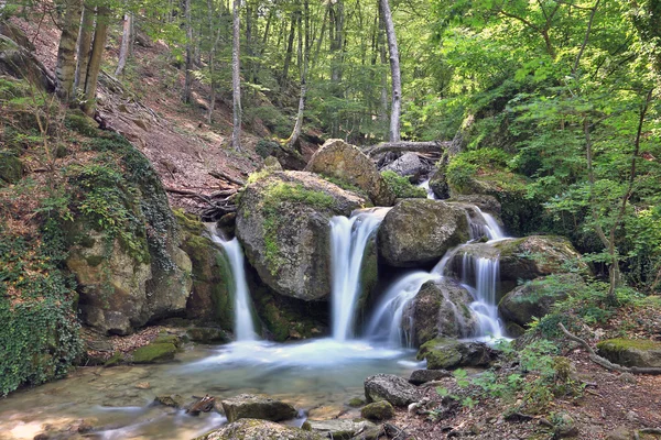 Nice waterfall in mountain forest — Stock Photo, Image