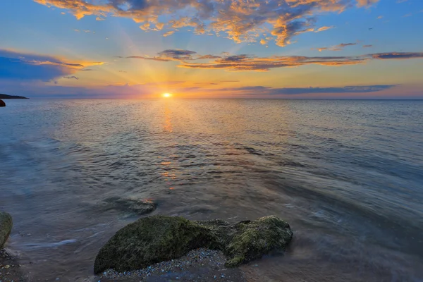 Solnedgang på havet - Stock-foto