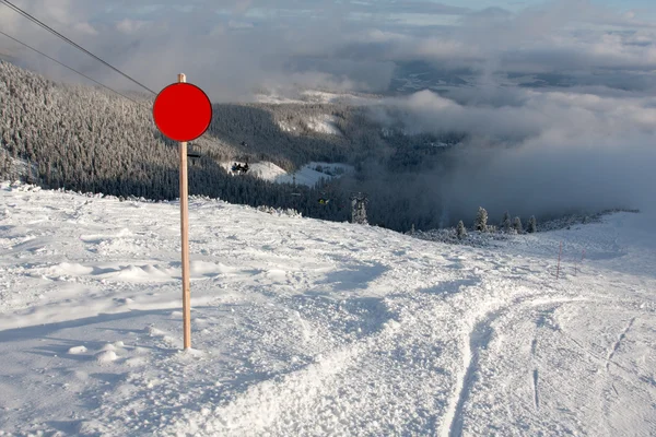 Red round sign on ski resort — Stock Photo, Image