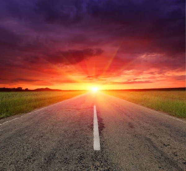 Asphalt road to sunset — Stock Photo, Image