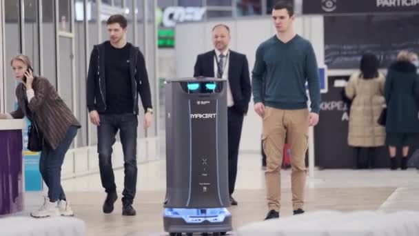 Modern robot riding in modern hall — Stock Video